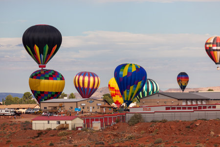 Page, Arizona / USA - October 31, 2014:  Several participants in the Lake Powell Balloon Regatta float above the the town of Page, Arizona in their annual event.のeditorial素材