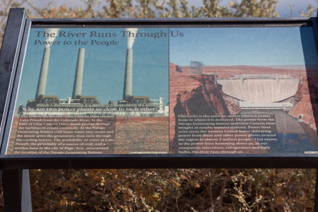 Page, Arizona, USA - October 31, 2014:  A metal informational sign a bout electrical power generation from Glen Canyon Dam and the Navajo Generating Station near Page, Arizona.のeditorial素材