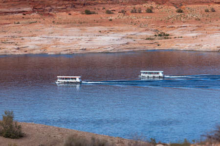 Page, Arizona, USA - October 31, 2014:  Two sightseeing cruise boats navigating on Lake Powell near Antelope Point in Arizona.のeditorial素材