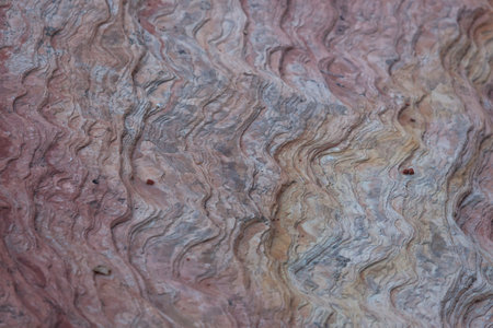 Layers of ancient sandstone rock in pastel colors in Zion National Park, Utah. Background.