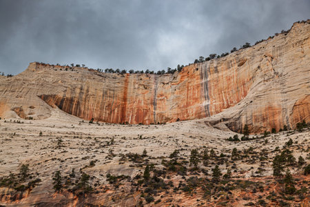 Huge sandstone mountains that have eroded over time with unique patterns and textures in Zion National Park, Utah.の写真素材