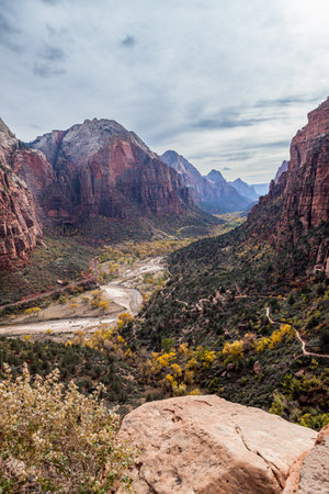 The Zion Canyon with the Virgin River and a hiking trail leading up to the popular attraction of Angel's Landing at Zion National Park, Utah.の写真素材