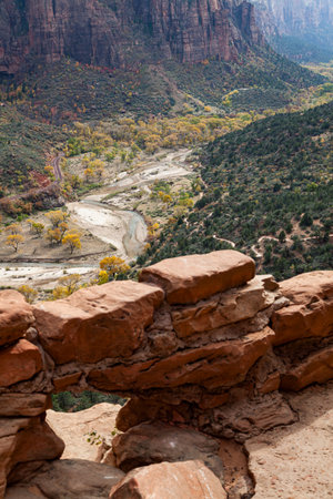 Zion Canyon view with the Virgin River as seen from the trail with a small wall and drainage hole at Zion National Park, Utah.の写真素材