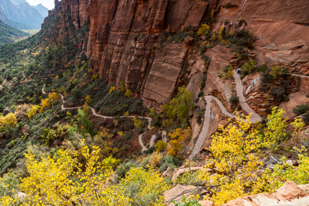 A section of trail with people hiking up to the popular attraction of Angel's Landing shows the enormity of the canyon at Zion National Park, Utah.の写真素材