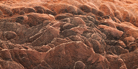 A section of ancient sandstone sediment showing eroded layers in a unique pattern as a background.の写真素材