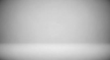 Abstract gray gradient. Empty minimalist studio room display. Clean, backdrop. For product photos. Subtle gray wall floor smooth.の素材