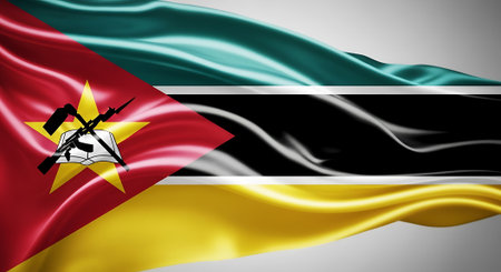 Silk texture Mozambique national flag in motion. It represents African country symbol, with red, green, black and yellow colors.の素材