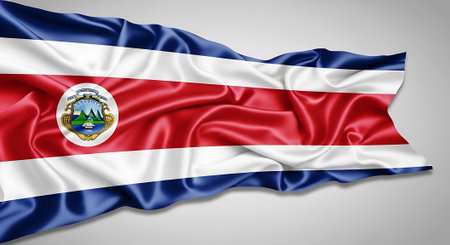 Silk flag of Costa Rica flapping in breeze. National symbol representing pride and identity. Costa Rican identity and patriotic design.の素材