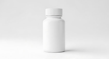 White plastic bottle mockup. Medicine bottle. Pill bottle. Healthcare and supplement concept. Mock up template. Isolated on white background.の素材