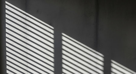 Abstract striped shadow on wall backdrop. Geometric light shape with linear lines. Interior wall with blinds or shades illumination.の素材