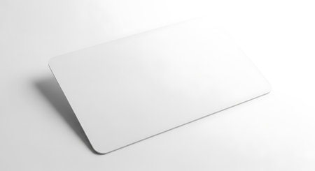 Minimalist presentation of blank white card. Clean, simple mockup great for presentations and product promos. Neutral scene. Mockup on white background.の素材