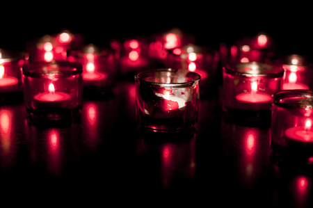 Candles burning in the darkの写真素材