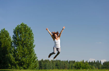 Young woman jumping outside