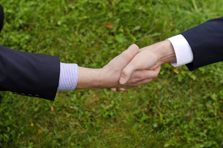 Handshake of two businessmen in suits