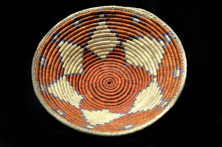 Native American Indian Woven Basket on a Black Backgroundの写真素材