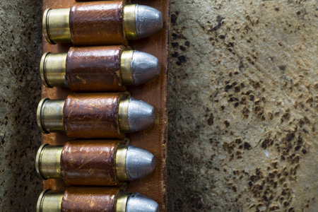 Close up Photo of an Old West Bandolier Belt with Colt 45 Bullets