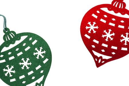 Colorful red and green Christmas ornaments on a white background.の写真素材