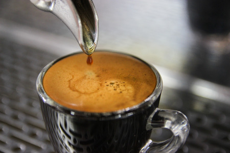 Closed up fresh Espresso shot from coffee machine, mdae from best roasting coffee beans.の写真素材