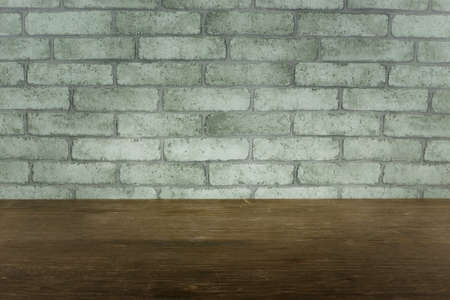 White concrete brick surface with dark dirty wooden table background. Balnk space template wallpaper...