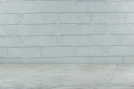 White concrete brick surface with dark dirty marble texture table background. Balnk space template wallpaper with perspective vintage frameの写真素材