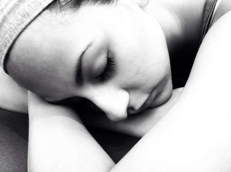 A woman taking a nap on a sunny day.の素材