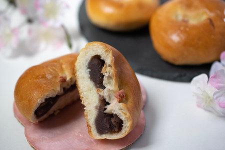 Close-up of delicious cherry blossom anpan divided into two with salted cherry blossoms in the middleの写真素材