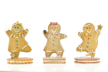 Three glittery holiday gingerbread cookies isolated on white background.の写真素材