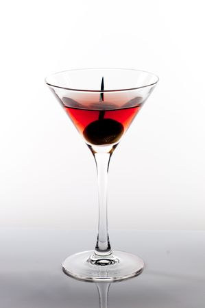 Martini glass with toothpick in olive.の写真素材