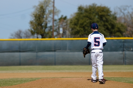 Little league baseball player taking the mound to pitch.の写真素材