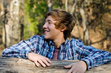 Outdoor portrait of teenage boy being silly.の写真素材