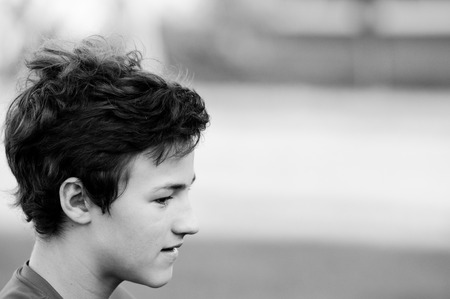 Black and white close-up of teenage boy with copy-space.の写真素材
