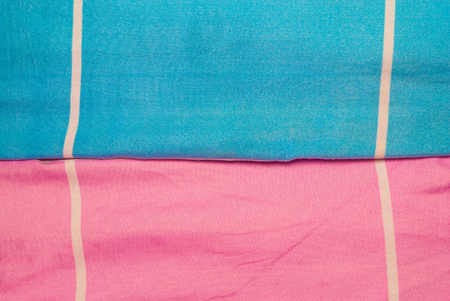 Closeup to White Line with Blue and Pink Fabric Backgroundの写真素材