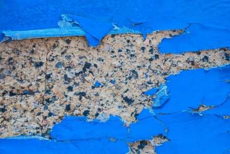 Closeup to Torn Blue Artificial Leather Pad Backgroundの写真素材