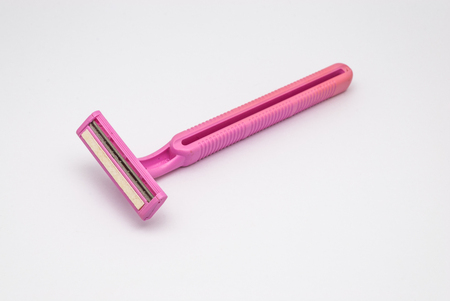 Closeup to Old Dirty Used Pink Twin Blades Razor, Isolatedの写真素材