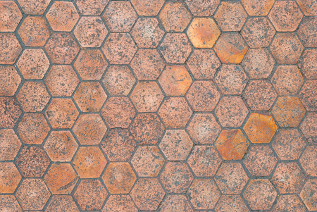 Closeup to Aged Hexagon Shaped Floor Tile Backgroundの写真素材