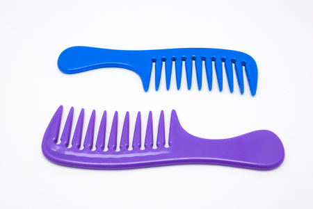 Closeup to Blue and Purple Plastic Comb, Isolatedの写真素材