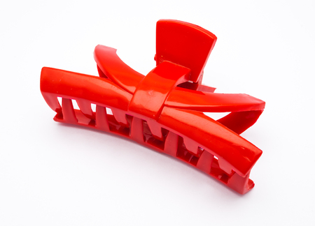 Closeup to Red Plastic Hair Clip, Isolatedの写真素材