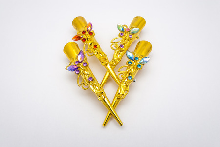 Closeup to Old Luxury Decorated Golden Butterfly Hair Clips, Isolatedの写真素材