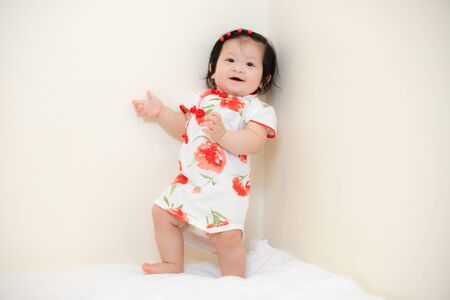 Asian Thai Baby Girl in Cheongsam Dress, Chinese New Yearの写真素材