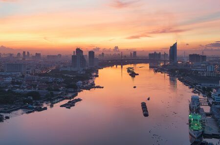 Chao Phraya River at Sunrise, Bangkok, Thailand	の写真素材