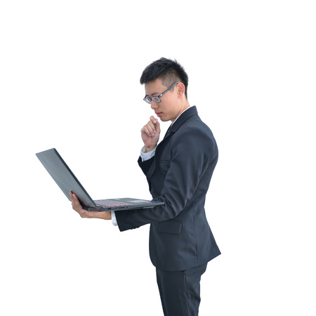 Asian Business man thinking while using laptop computer isolated on white background, clipping path insideの写真素材