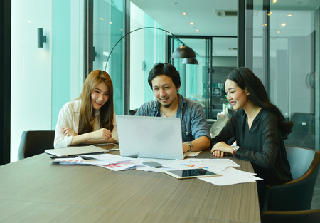 Teamwork of Asian business people working in meeting roomの写真素材