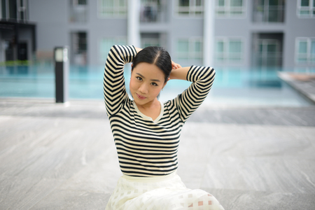 Beautiful smiling Thai woman with casual dress with copy space for textの写真素材