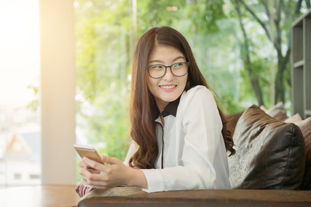 Portrait of Asian sexy business woman with a laptopの写真素材