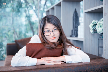 Portrait of Asian sexy business woman with a laptopの写真素材