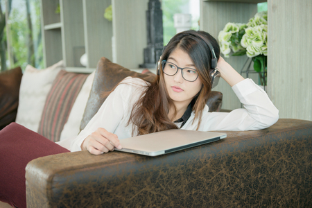 Portrait of Asian sexy business woman with a laptopの写真素材
