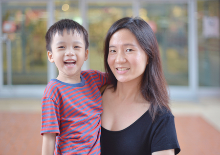 portrait of young Asian mother and her kid are happyの写真素材