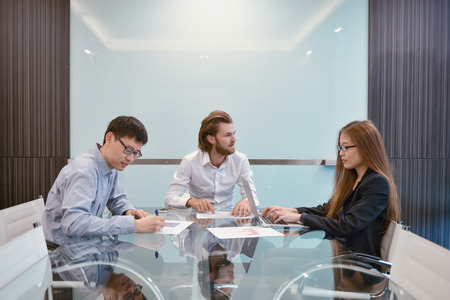 Group of business people meeting in a meeting room, sharing their ideas, Multi ethnicの写真素材