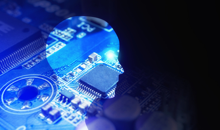 Side view of human head shape and motherboard. Model isolated on blue background, artificial...