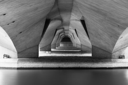 Reflection under Bridge in structure of architecture concept, urban city, Downtown area. Monochrome...